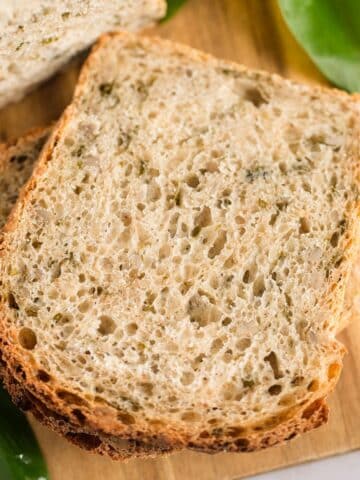 chive bread slices on a cutting board.